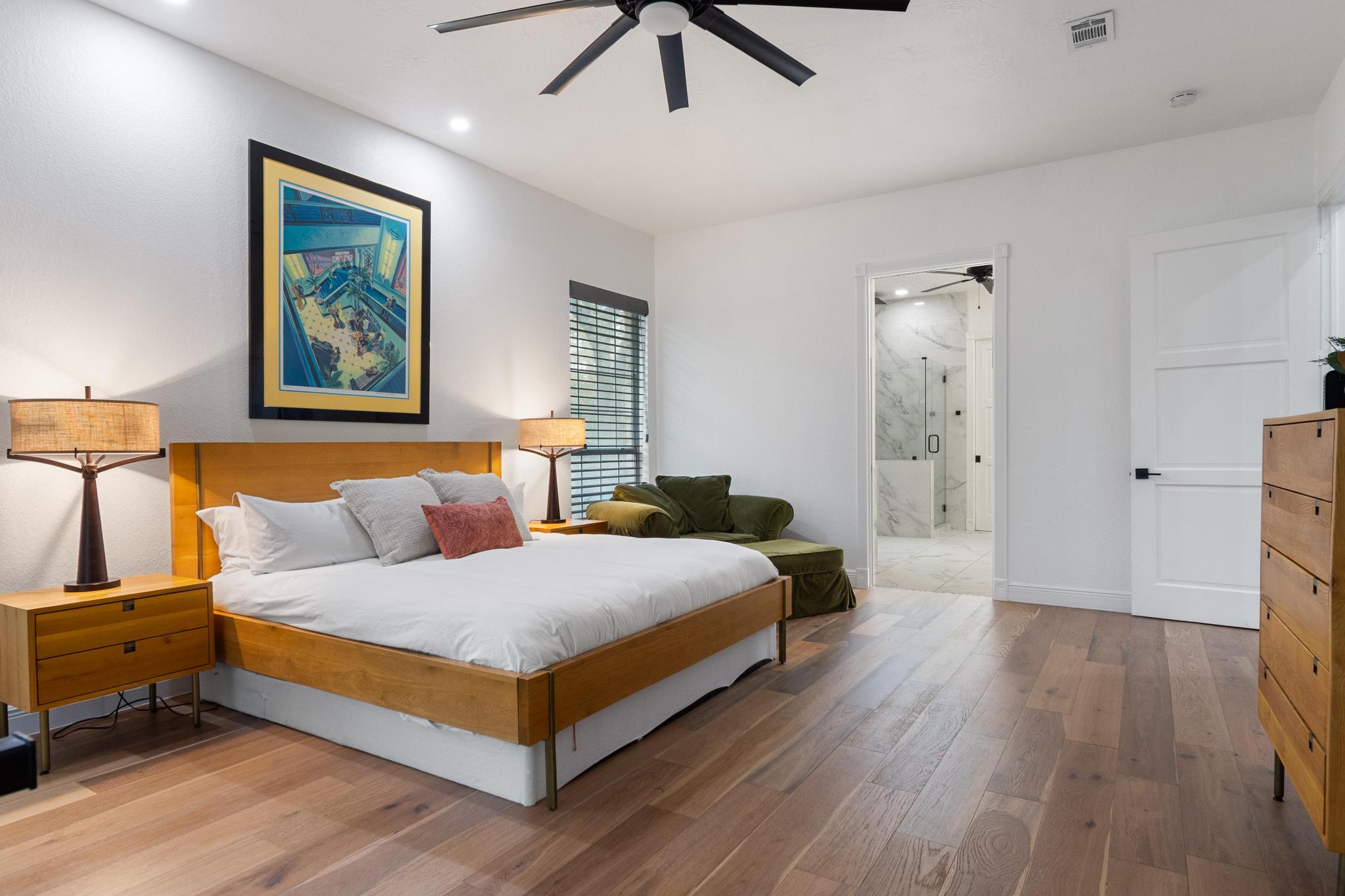 346 The Oaks Boulevard Elgin, TX 78621 - Photo 14 of 39 a bedroom with a bed and a chandelier