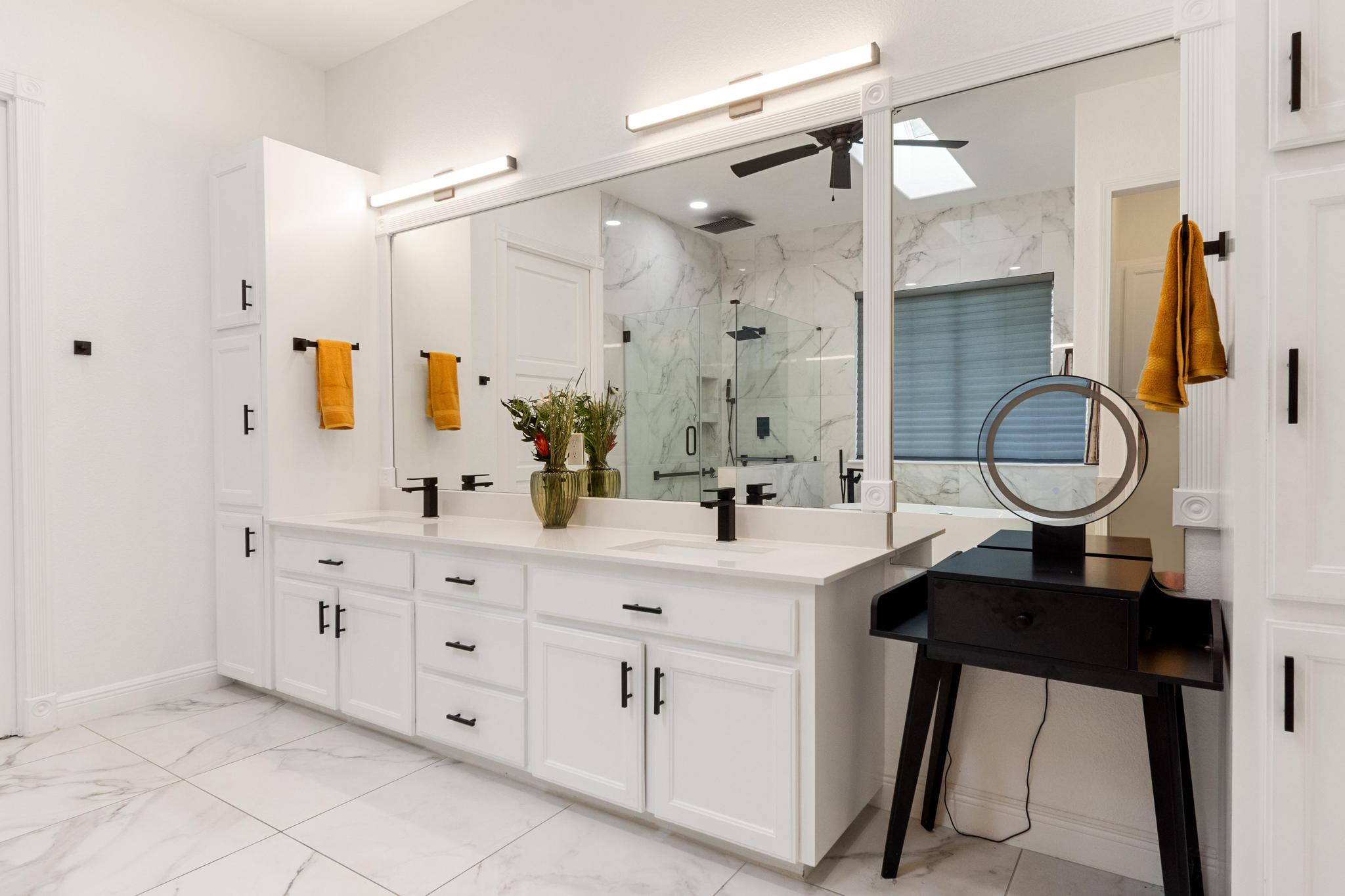 346 The Oaks Boulevard Elgin, TX 78621 - Photo 19 of 39 a bathroom with a double vanity sink mirror and shower