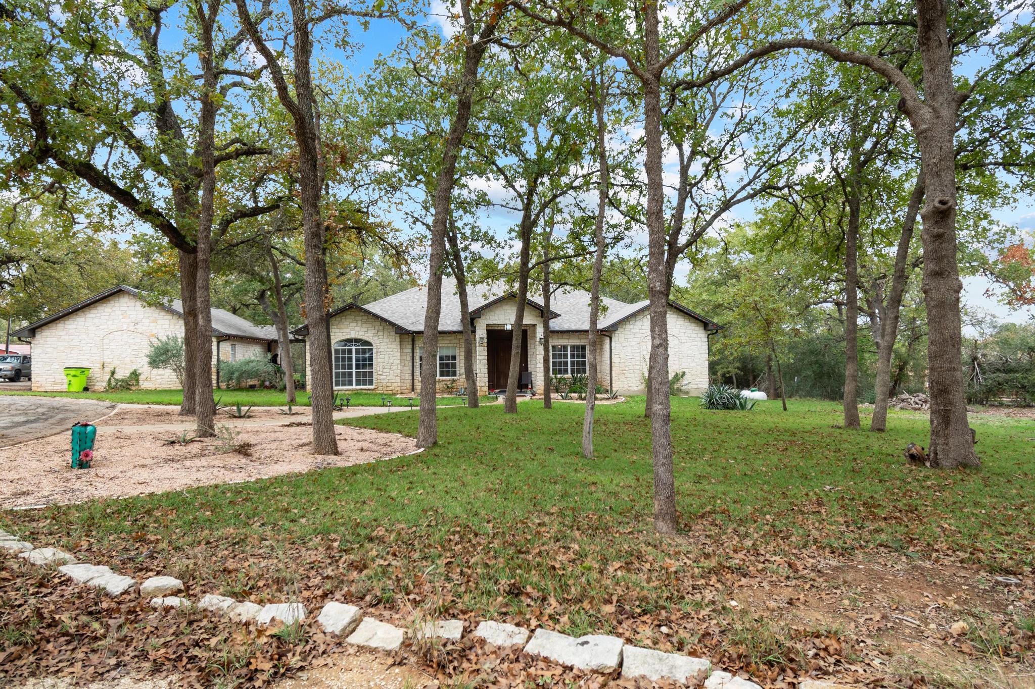 346 The Oaks Boulevard Elgin, TX 78621 - Photo 2 of 39 a view of a house with a yard and tree s