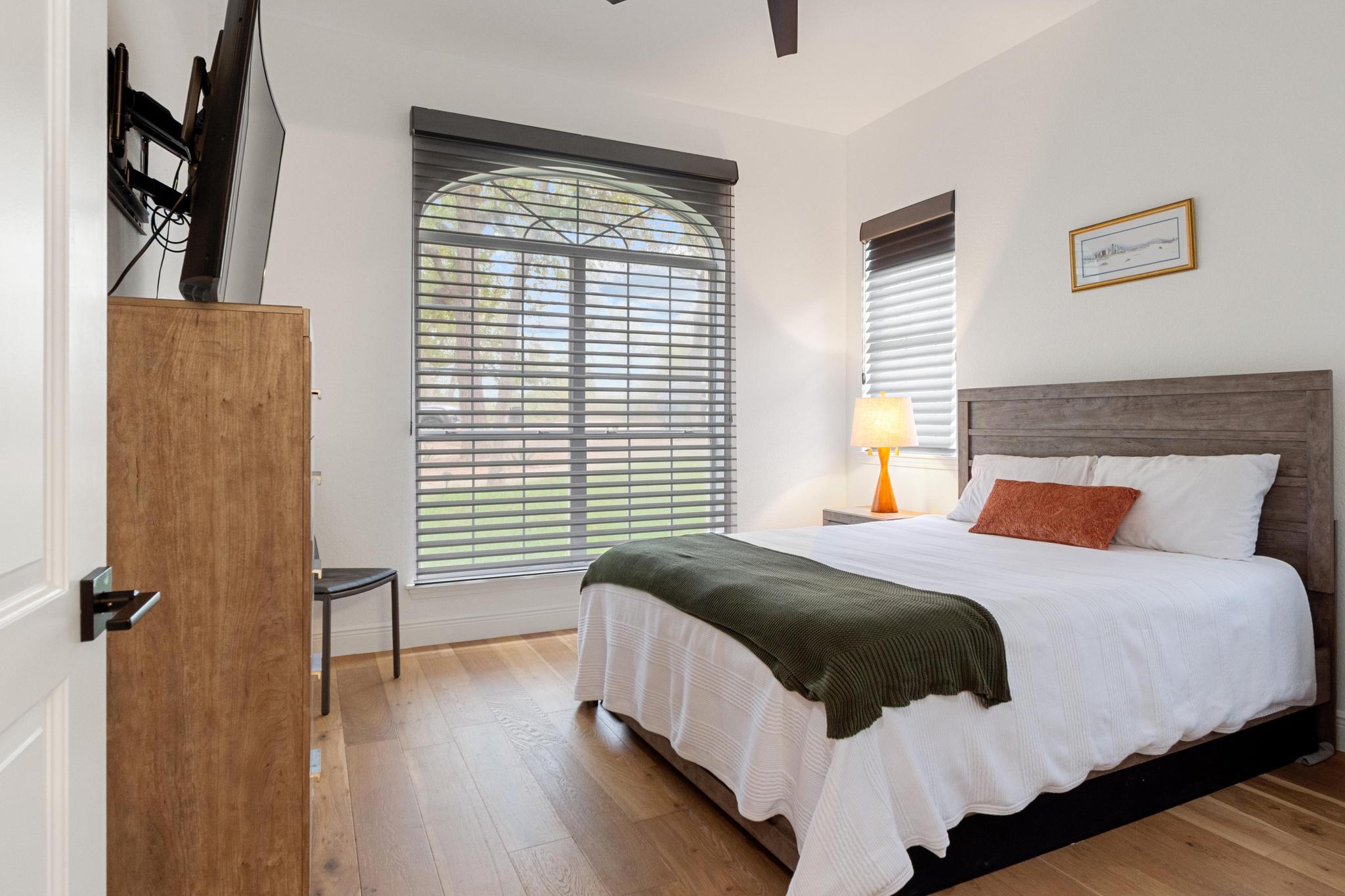 346 The Oaks Boulevard Elgin, TX 78621 - Photo 22 of 39 a bedroom with a bed and wooden floor