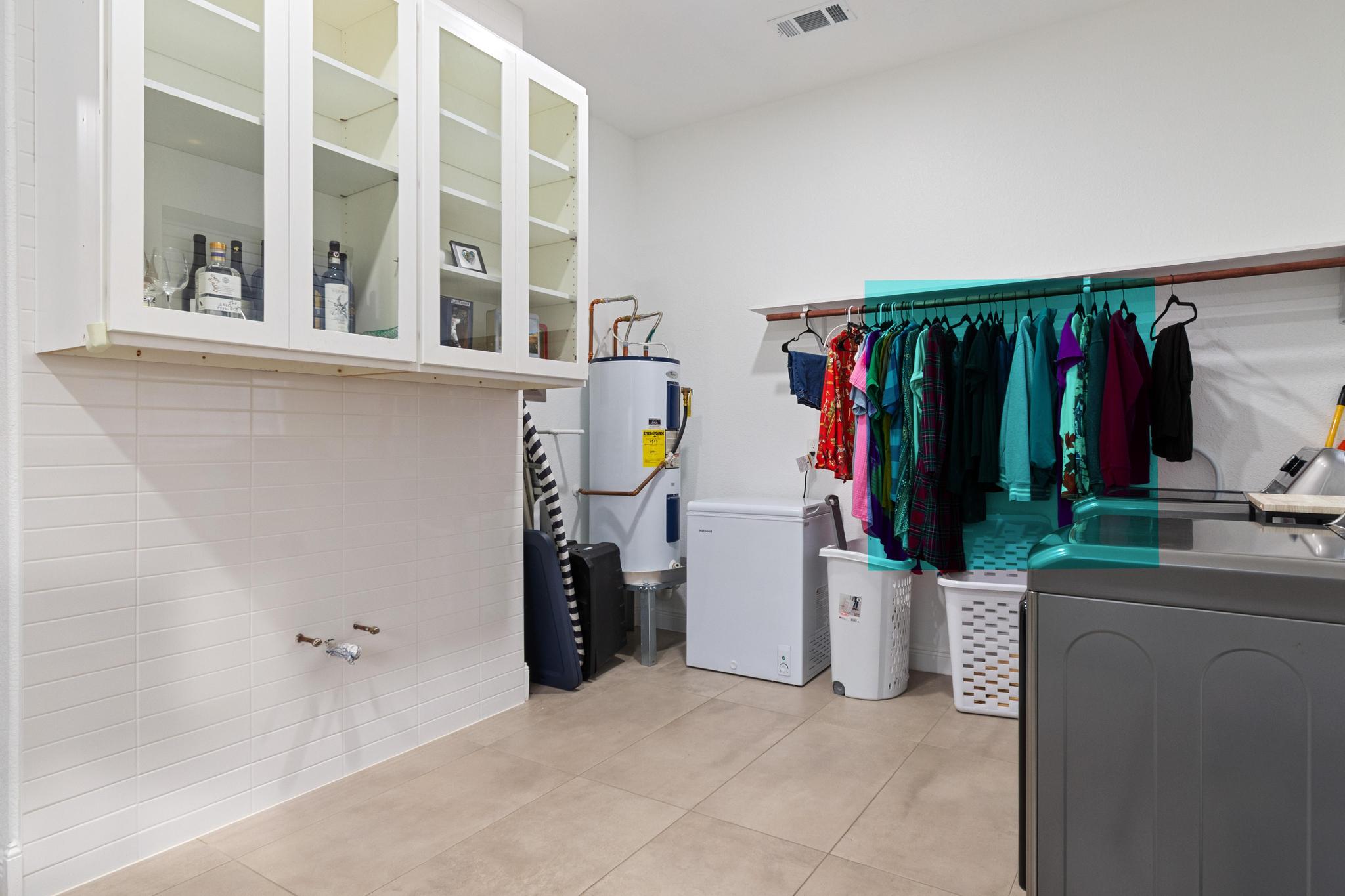 346 The Oaks Boulevard Elgin, TX 78621 - Photo 27 of 39 a view of walk in closet with clothes and shoes