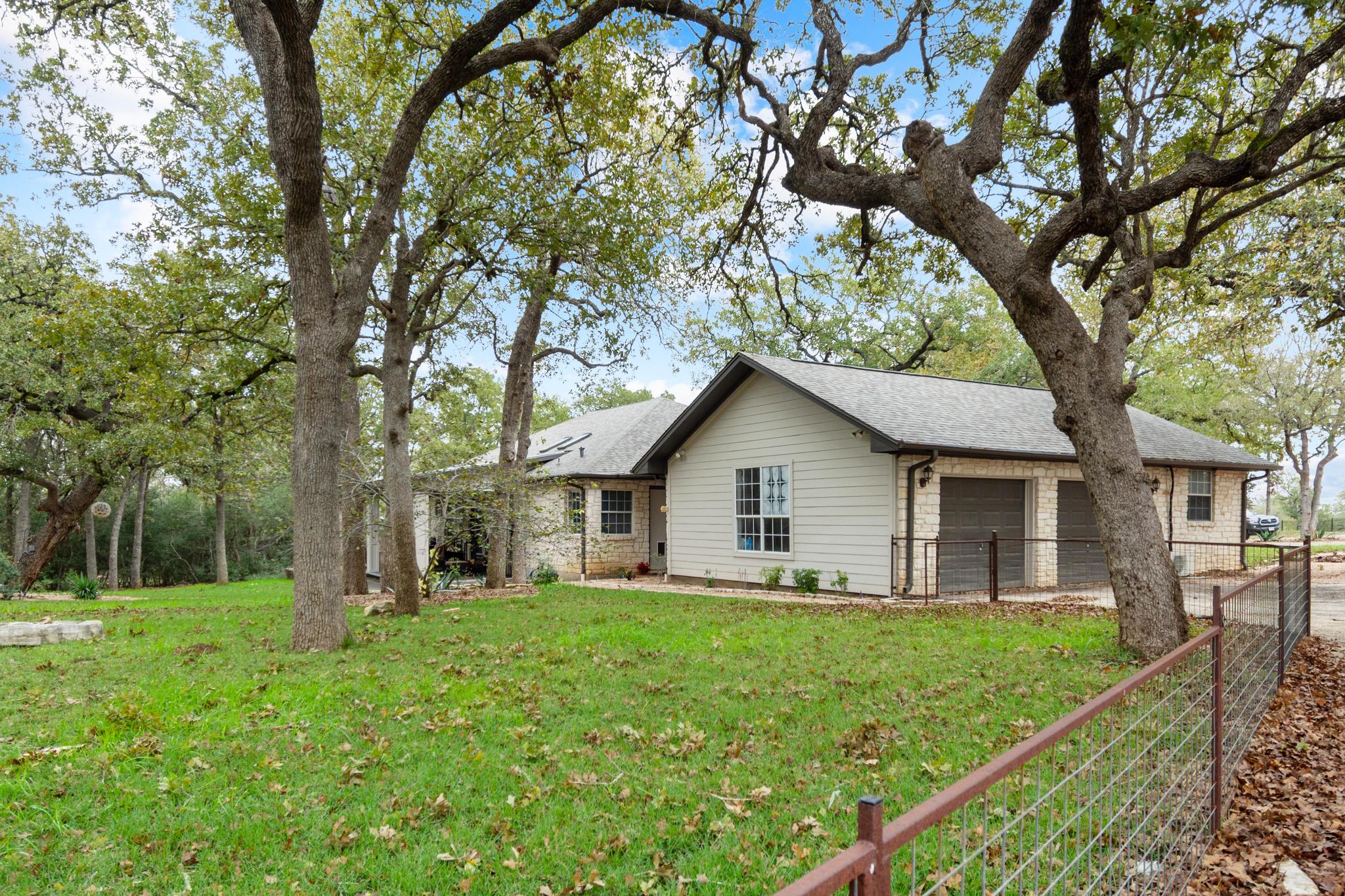 346 The Oaks Boulevard Elgin, TX 78621 - Photo 34 of 39 a view of a house with a yard