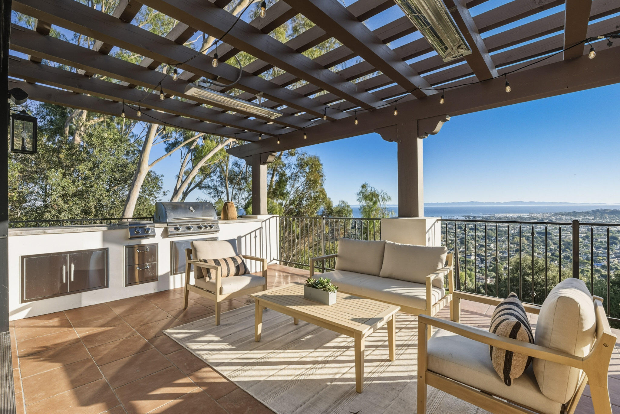 210 Las Alturas Road Santa Barbara, CA 93103 - Photo 5 of 61 a view of a patio with couches table and chairs with wooden floor