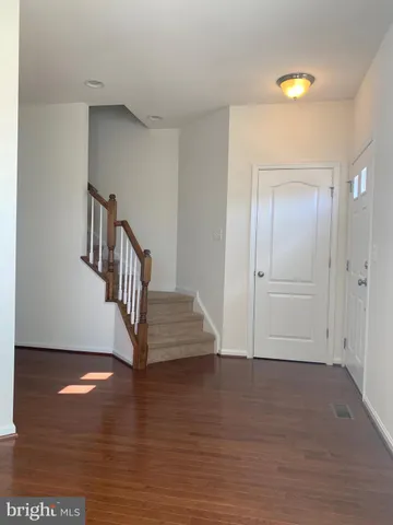 a view of entryway with wooden floor