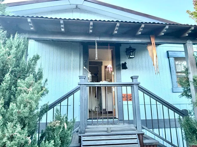 a view of a balcony with lots of green space