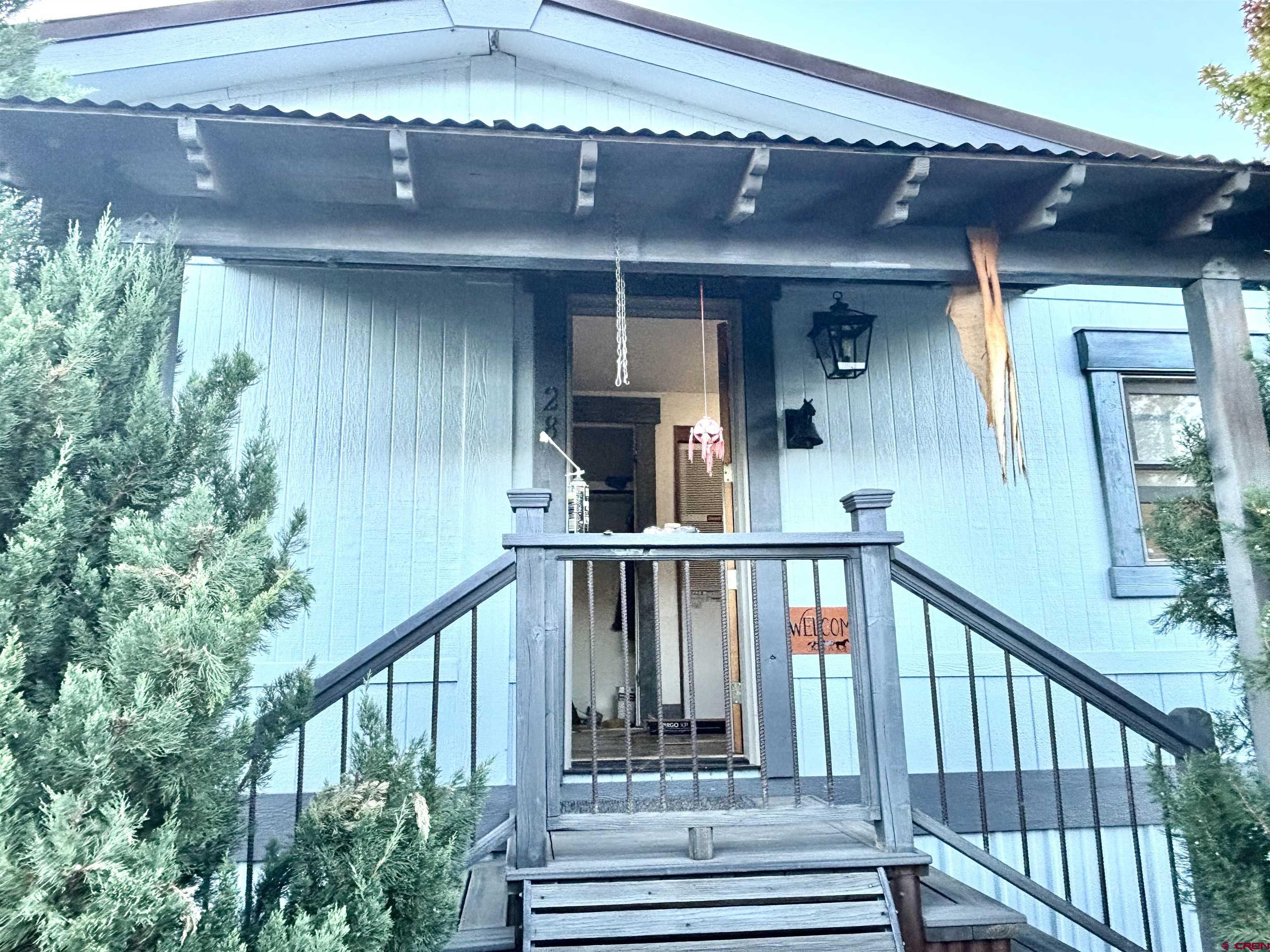 a view of a balcony with lots of green space