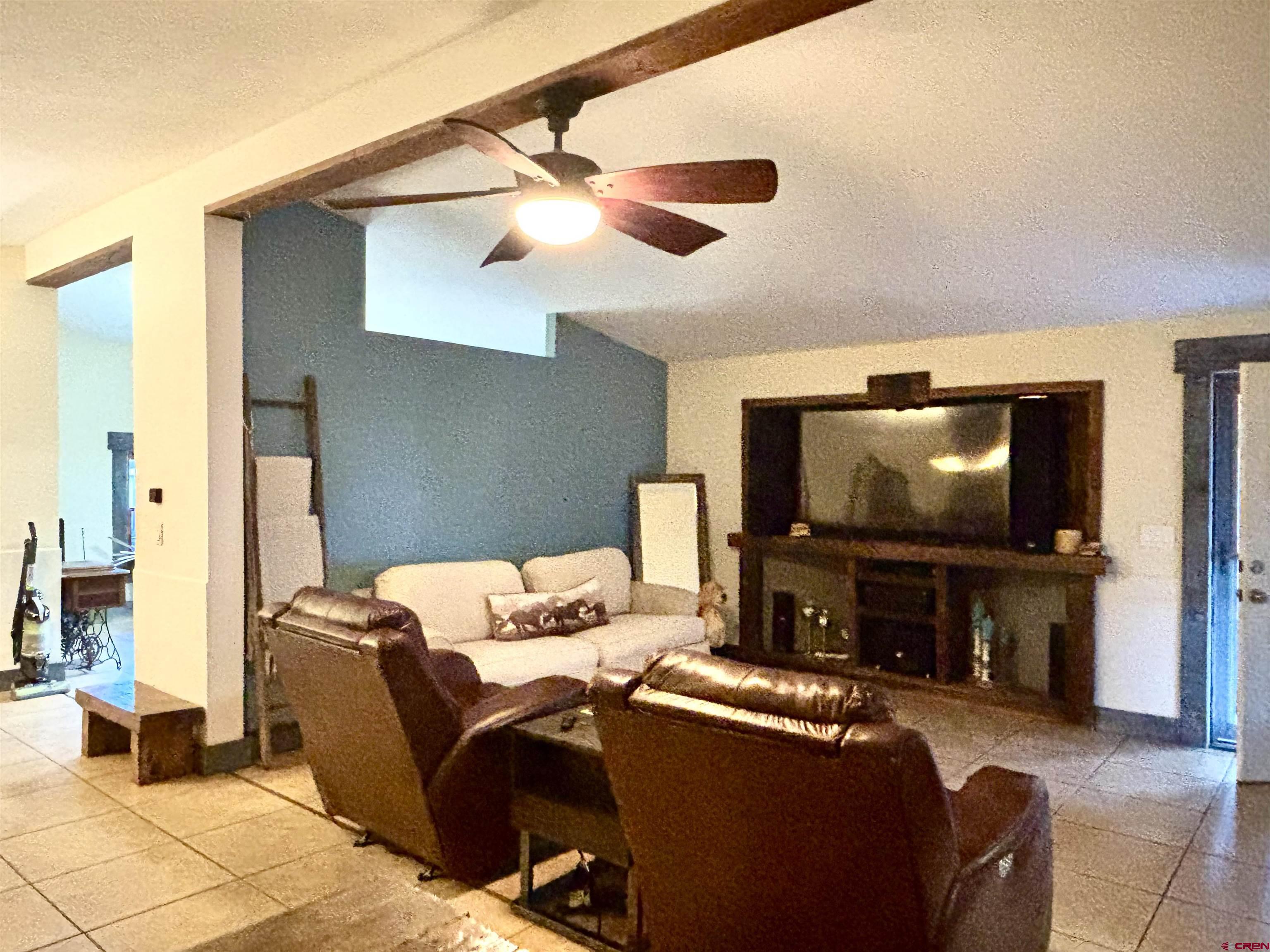 28 Raspberry Circle Durango, CO 81301 - Photo 12 of 26 a living room with furniture and a flat screen tv