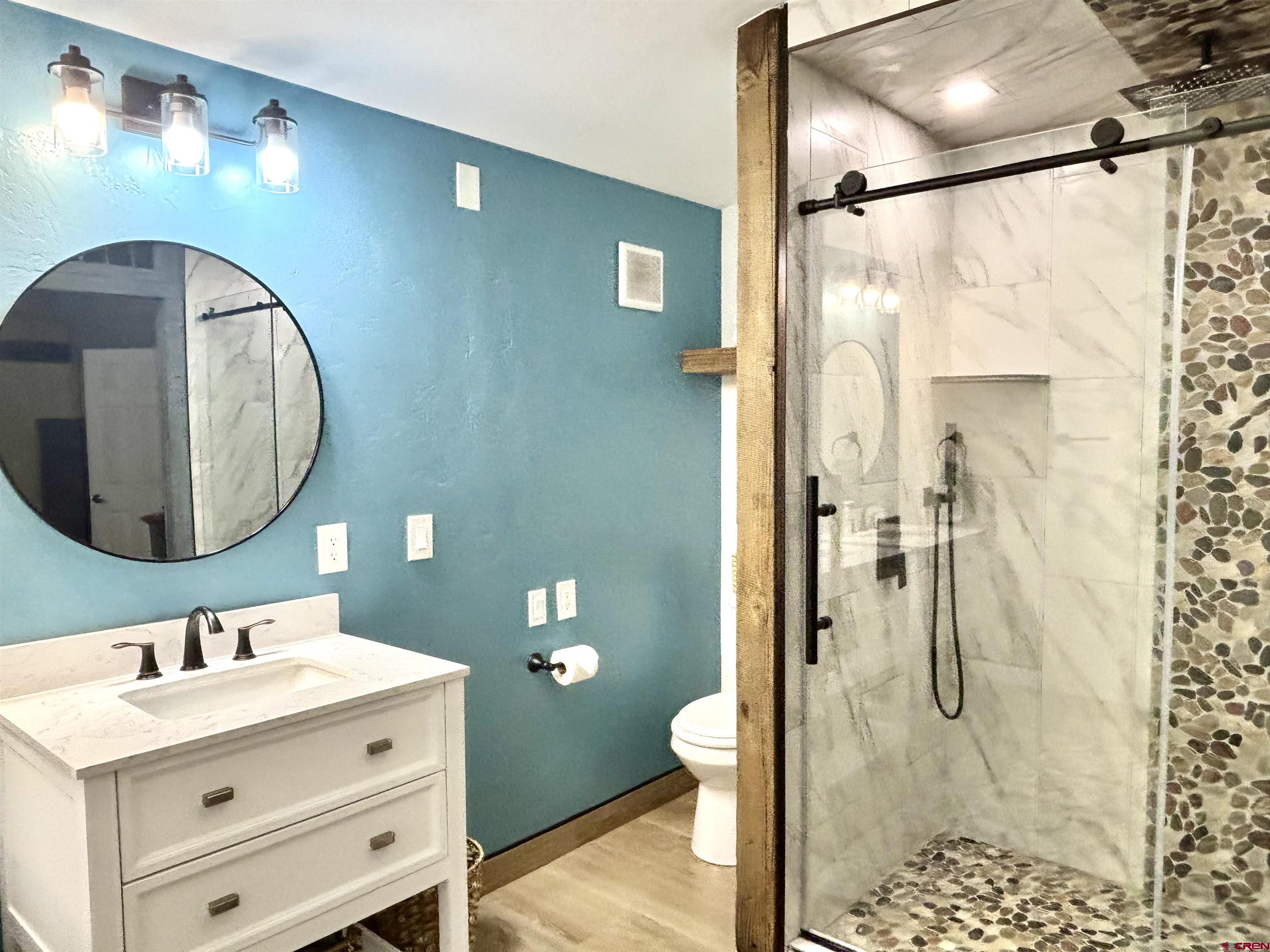 28 Raspberry Circle Durango, CO 81301 - Photo 13 of 26 a bathroom with a sink and a mirror