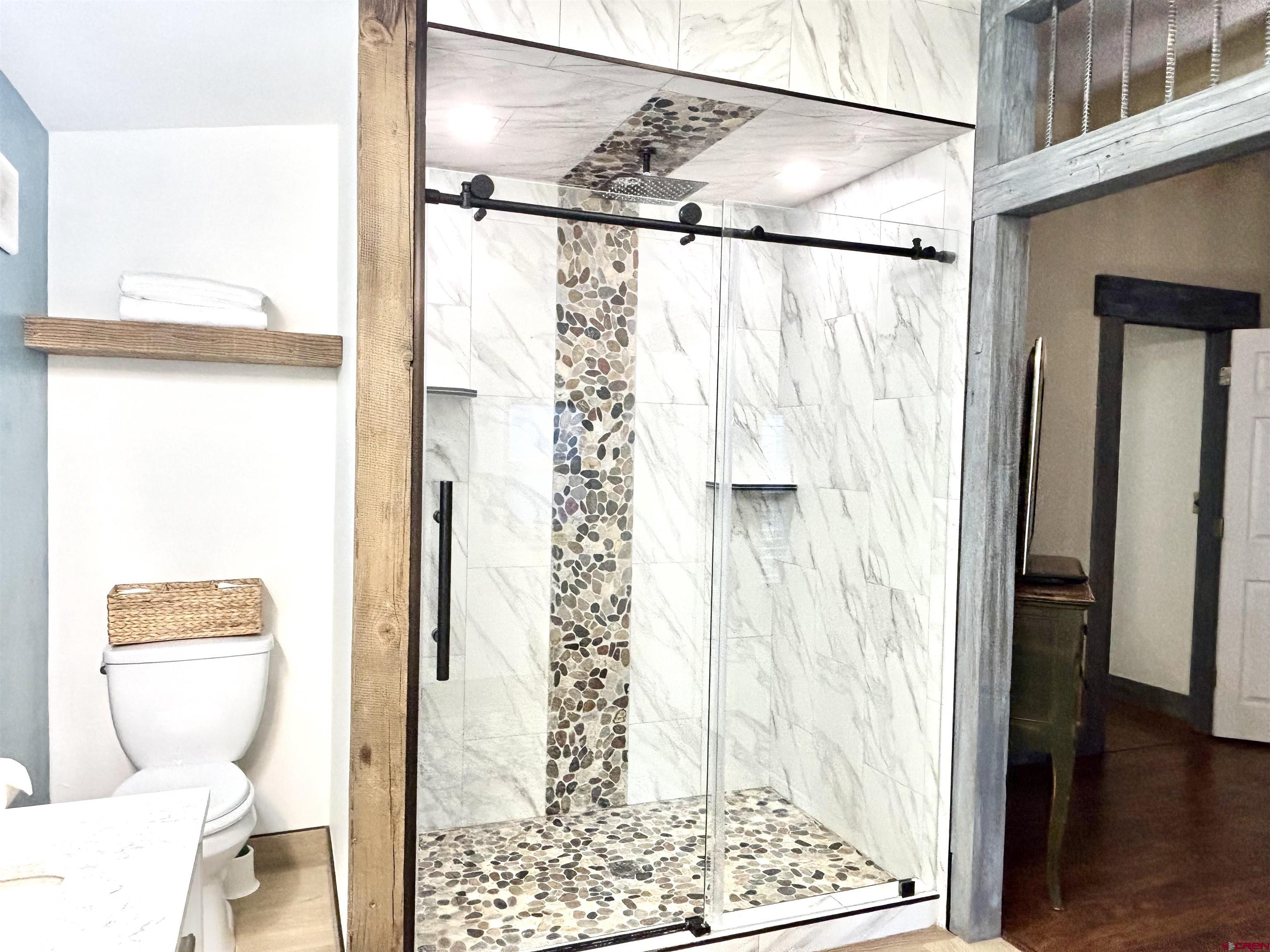 28 Raspberry Circle Durango, CO 81301 - Photo 15 of 26 a bathroom with a toilet and a shower curtain