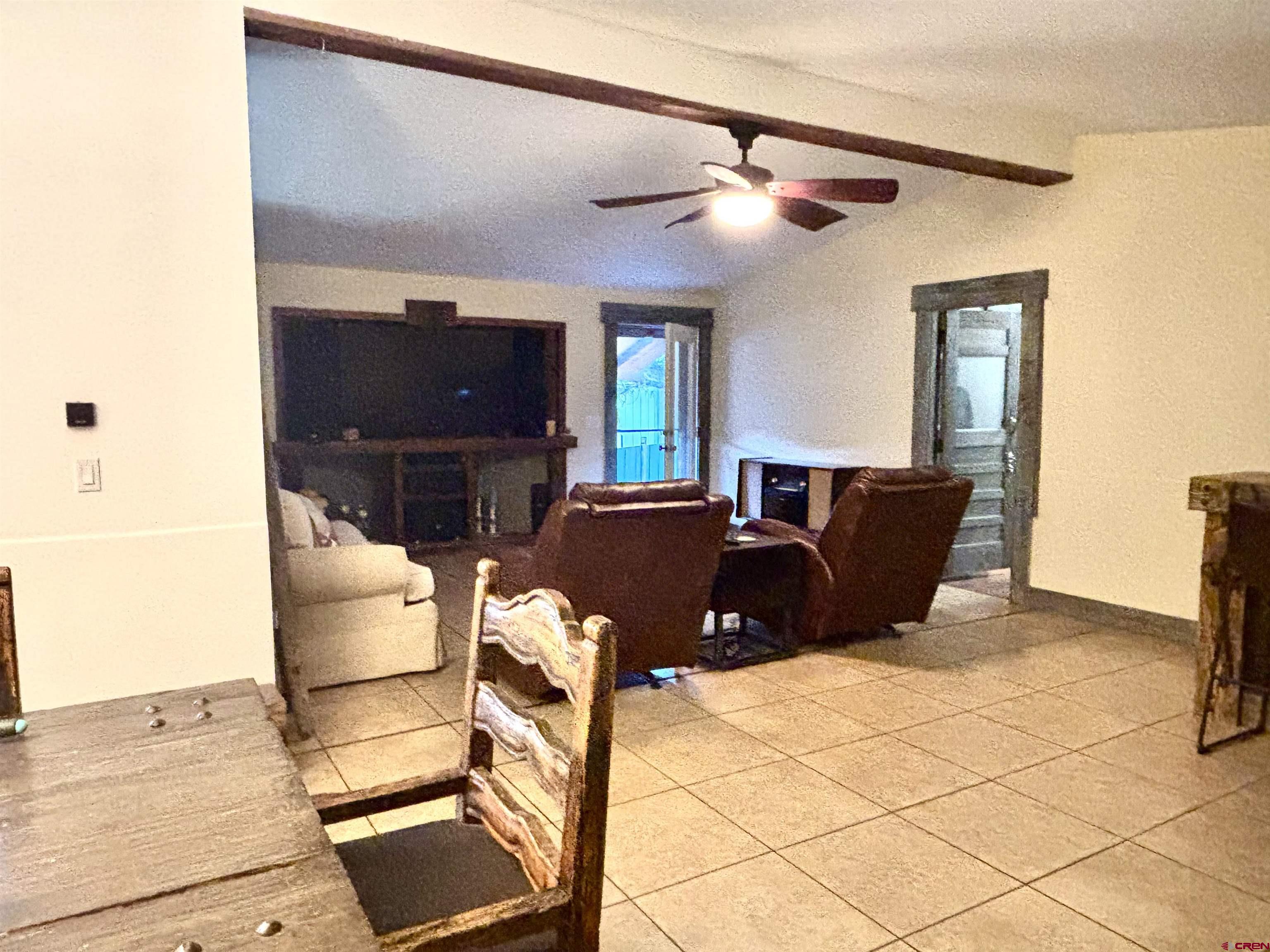 28 Raspberry Circle Durango, CO 81301 - Photo 24 of 26 a living room with furniture and a flat screen tv