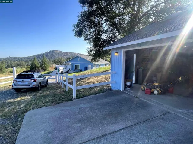 a view of a lake with large trees