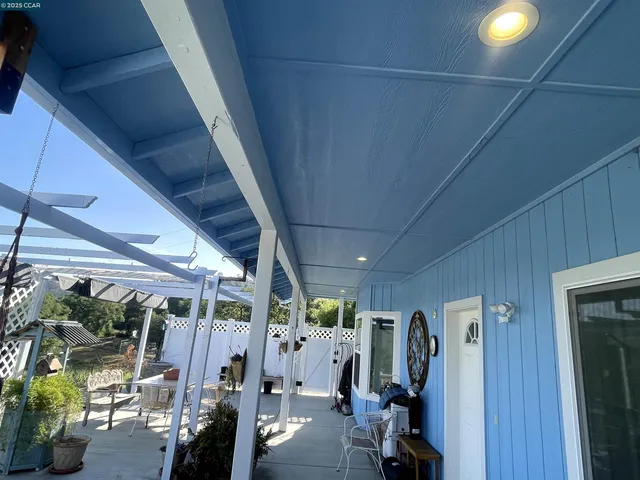 a tall yellow building in middle of the green field