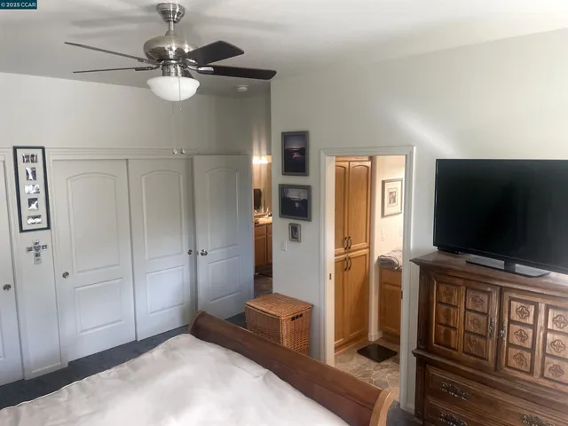 a living room with furniture a fireplace and a chandelier