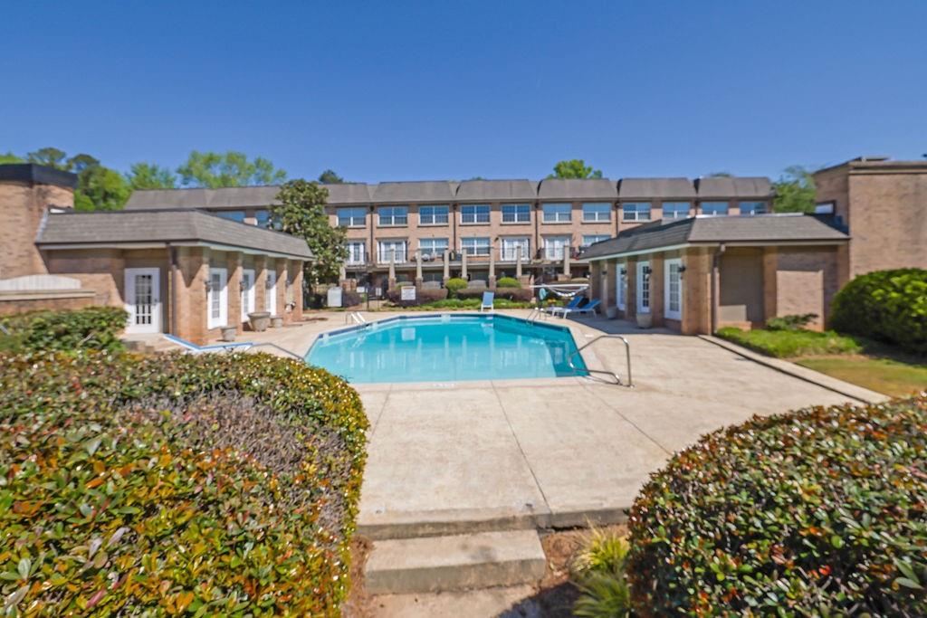 6980 Roswell Road, Unit B11 Atlanta, GA 30328 - Photo 14 of 14 a view of a house with a swimming pool