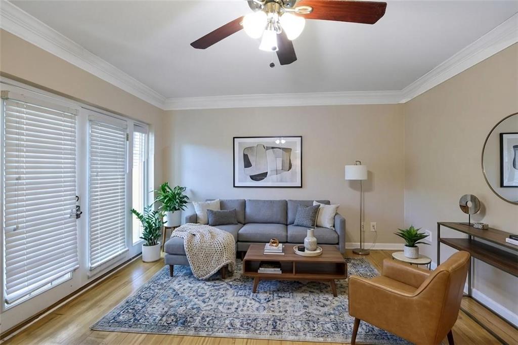 6980 Roswell Road, Unit B11 Atlanta, GA 30328 - Photo 4 of 14 a living room with furniture potted plant and a window