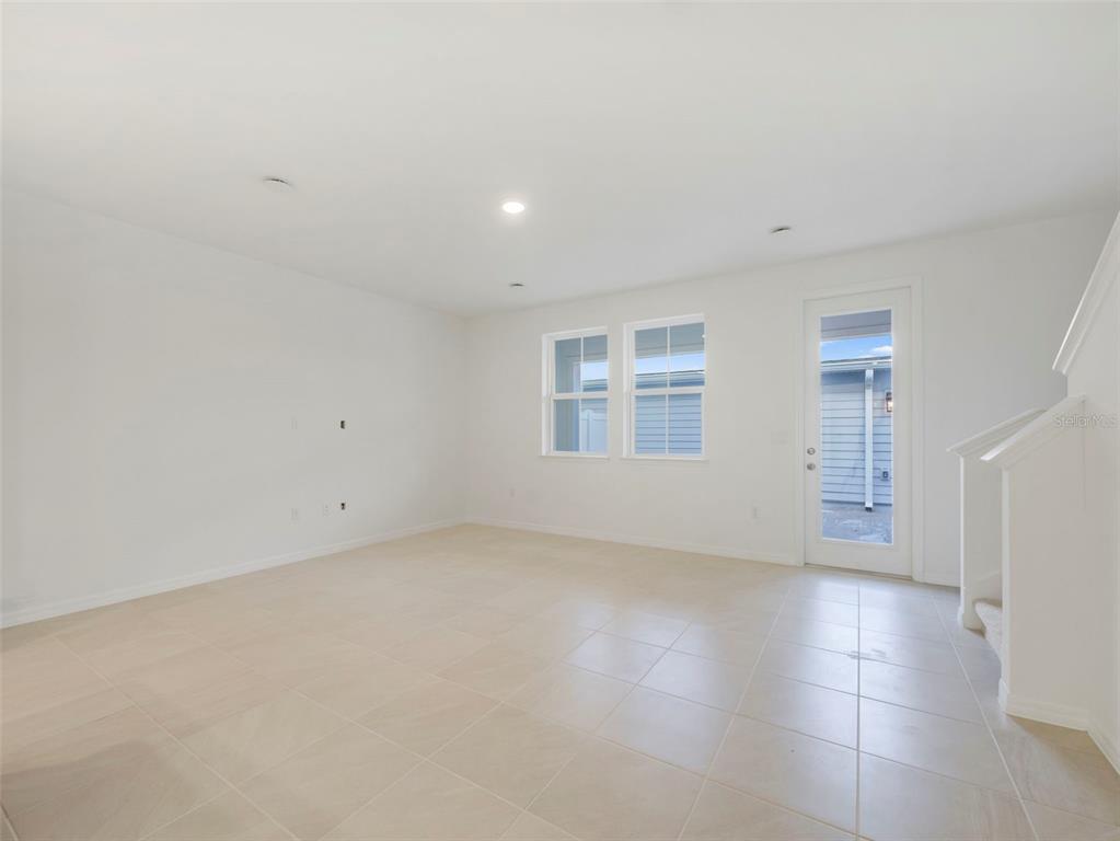 671 Clark Street Oviedo, FL 32765 - Photo 11 of 24 a view of an empty room with a window