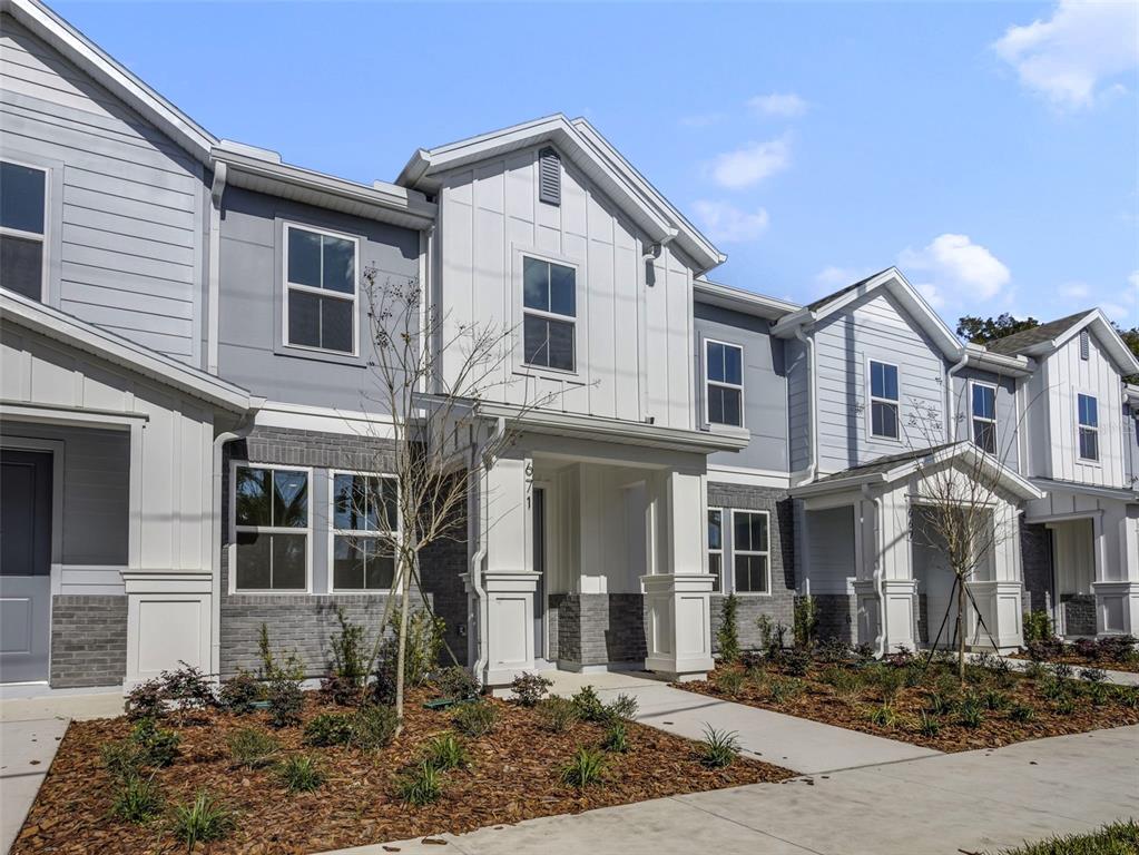 671 Clark Street Oviedo, FL 32765 - Photo 2 of 24 a front view of a house with garden