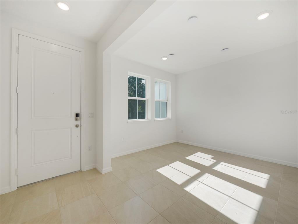 671 Clark Street Oviedo, FL 32765 - Photo 4 of 24 an empty room with windows