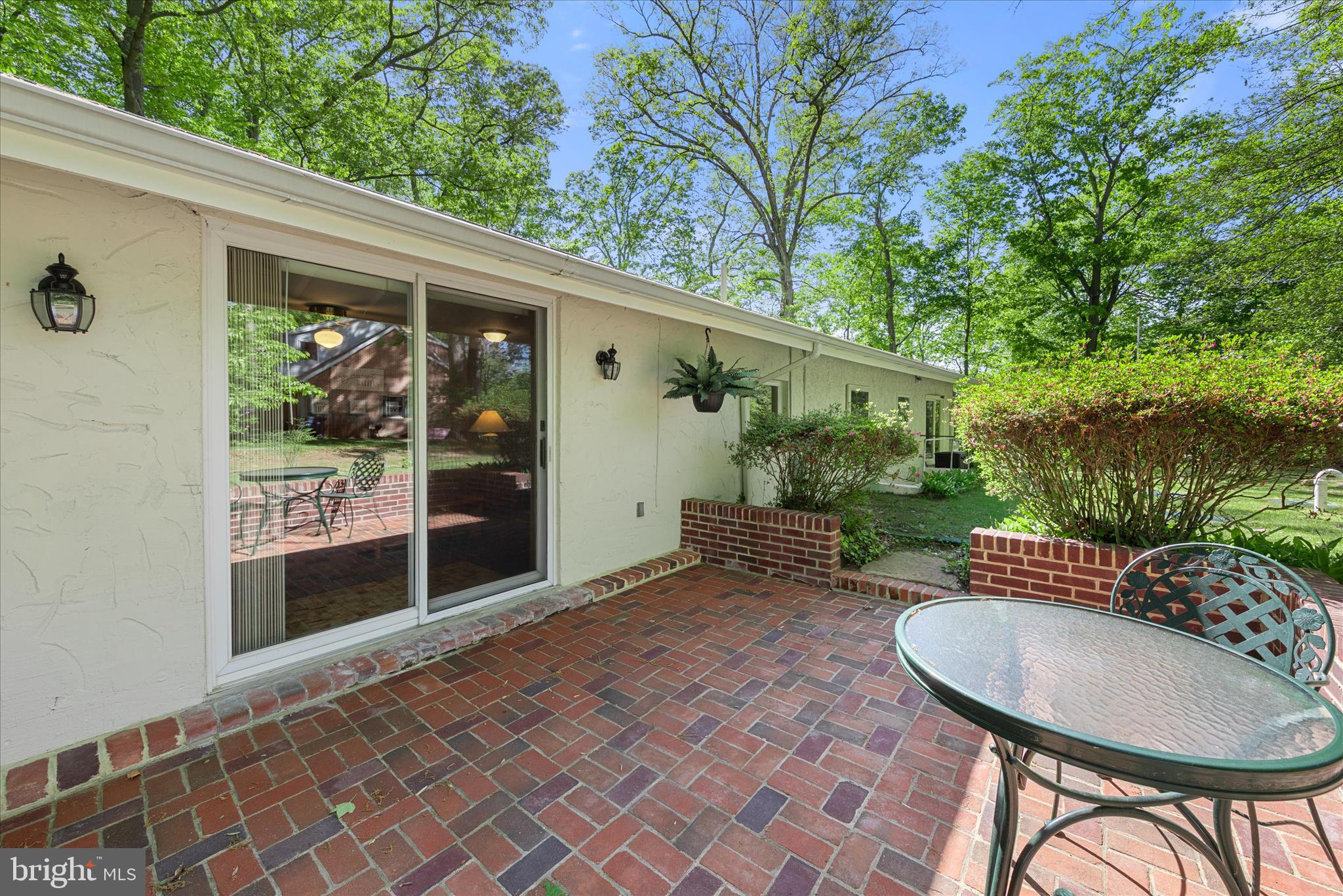 251 Rings End Road Millington, MD 21651 - Photo 27 of 47 a view of a patio with table and chairs potted plants and large tree