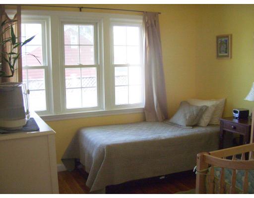 81 Stanley Road Newton, MA 02468 - Photo 11 of 17 a bedroom with a bed and a window