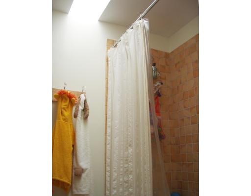 81 Stanley Road Newton, MA 02468 - Photo 13 of 17 a bathroom with a shower and a mirror