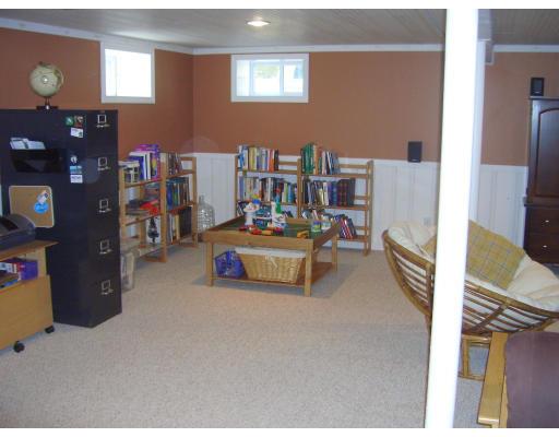 81 Stanley Road Newton, MA 02468 - Photo 15 of 17 a bedroom with furniture and a book shelf