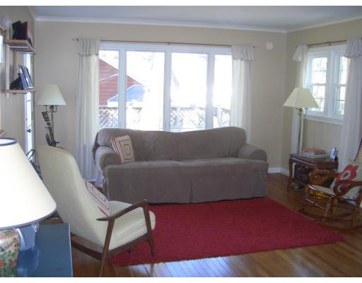 81 Stanley Road Newton, MA 02468 - Photo 2 of 17 a living room with furniture wooden floor and a large window