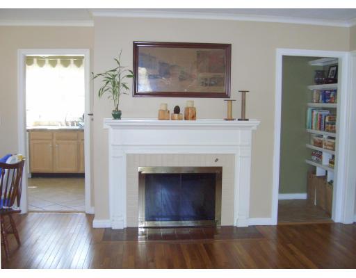 81 Stanley Road Newton, MA 02468 - Photo 4 of 17 a living room with a fireplace and a table