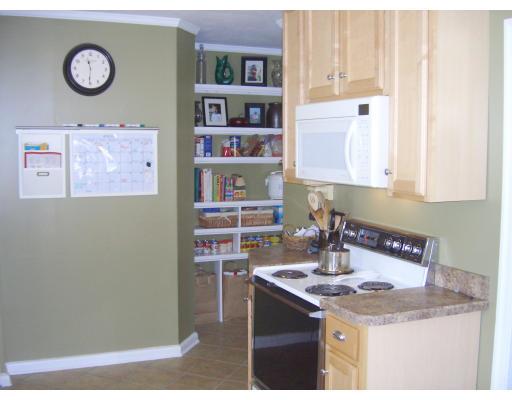 81 Stanley Road Newton, MA 02468 - Photo 6 of 17 a kitchen with a sink and a refrigerator