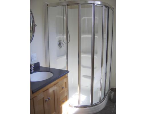81 Stanley Road Newton, MA 02468 - Photo 9 of 17 a bathroom with a granite countertop sink and a mirror
