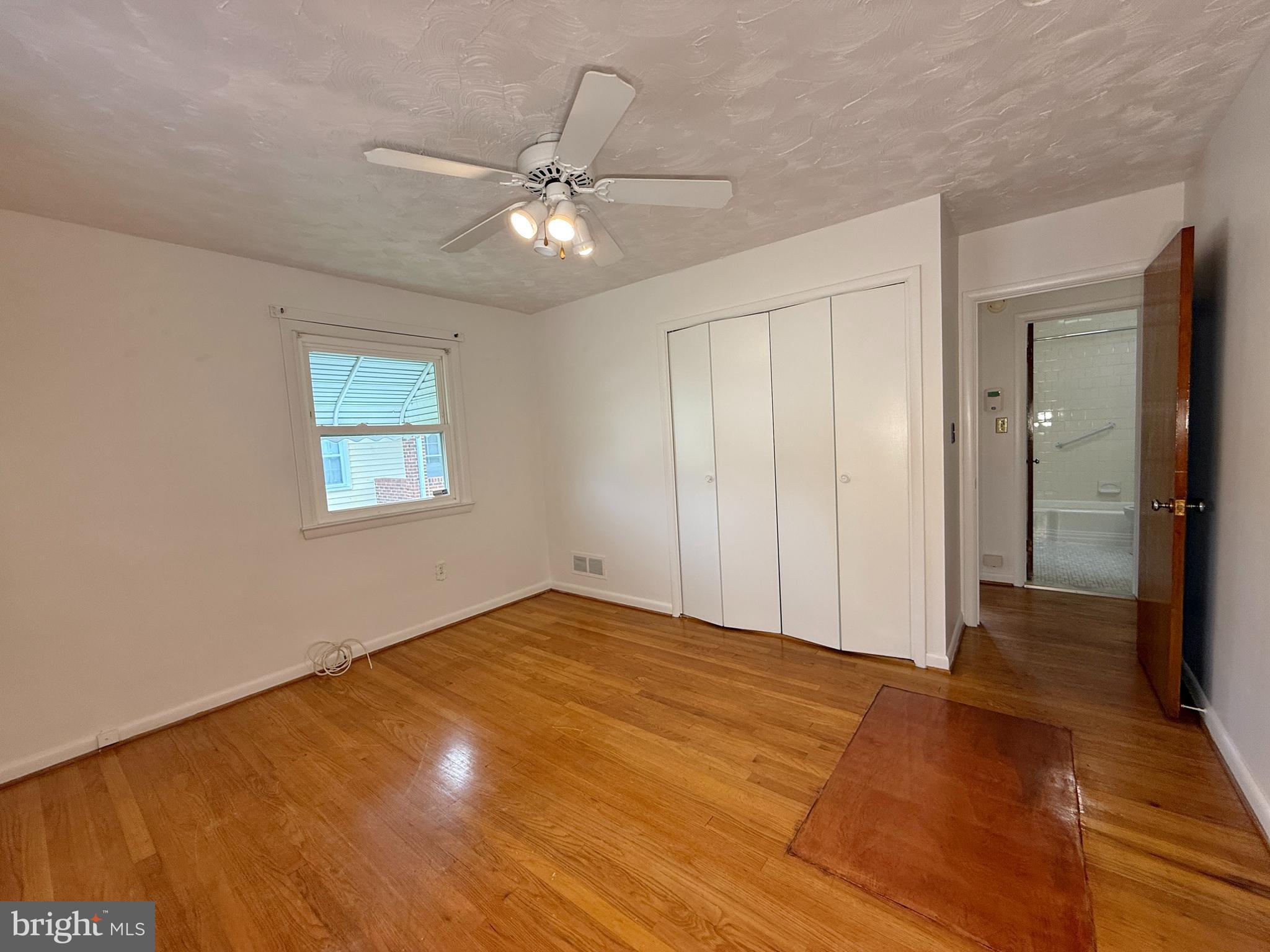 2002 Old Frederick Road Baltimore, MD 21228 - Photo 13 of 36 a view of an empty room with a chandelier fan