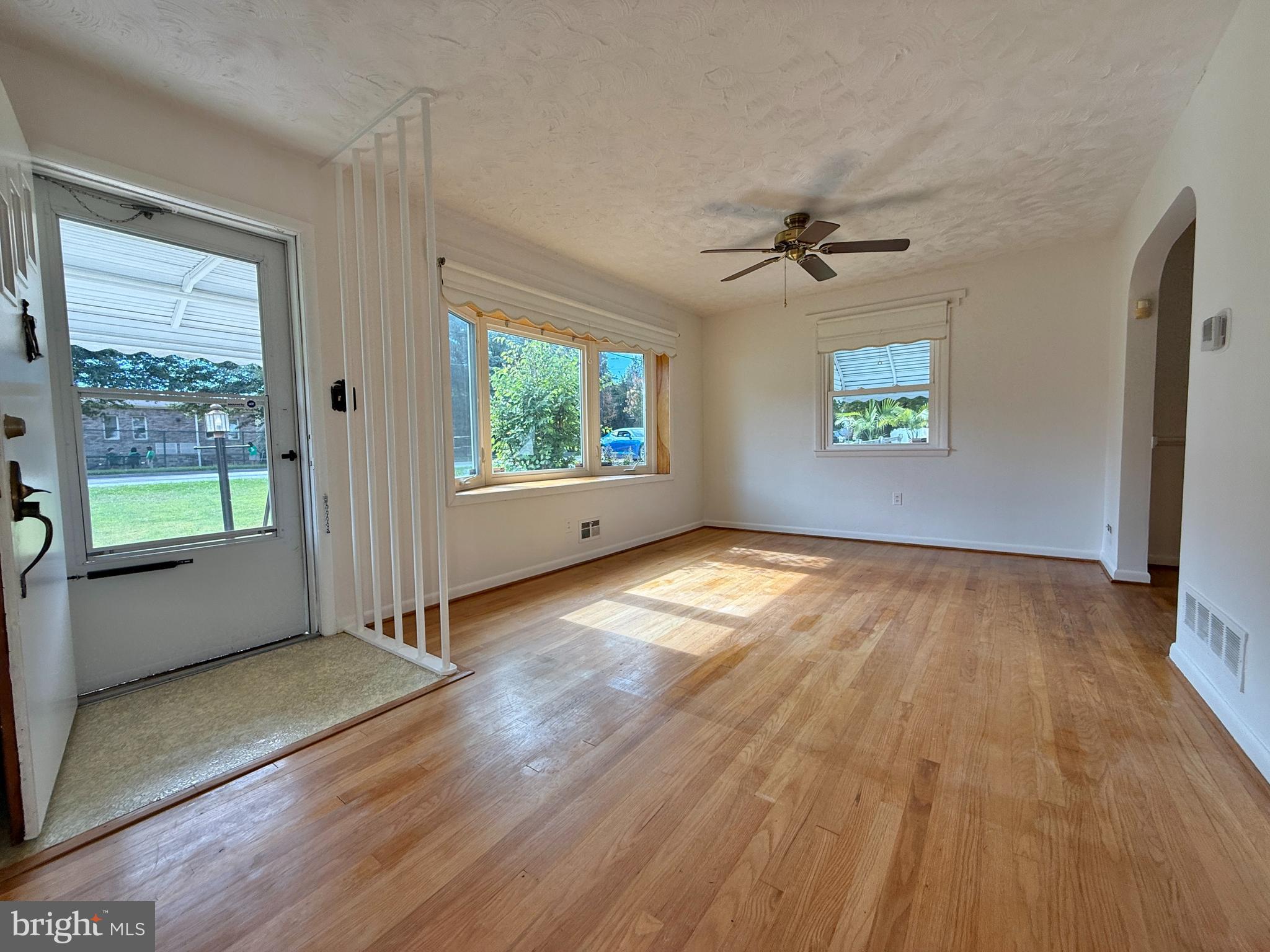 2002 Old Frederick Road Baltimore, MD 21228 - Photo 3 of 36 wooden floor in an empty room with a window