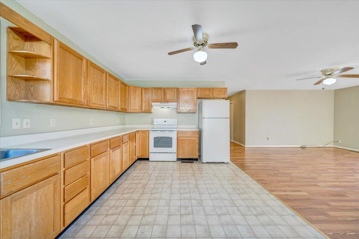 4902 Old Mountain Road Northeast Roanoke, VA 24019 - Photo 12 of 42 a kitchen with stainless steel appliances granite countertop a sink and cabinets