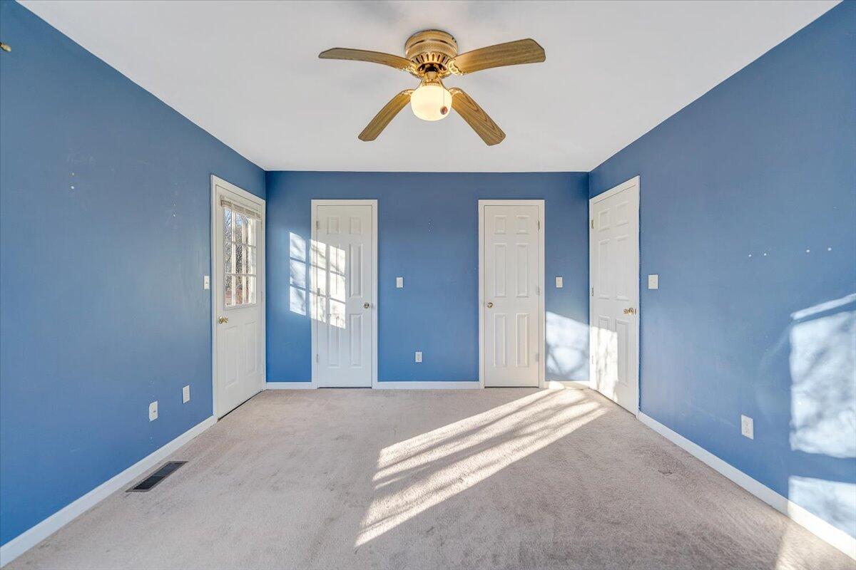 4902 Old Mountain Road Northeast Roanoke, VA 24019 - Photo 15 of 42 a bedroom with chandelier fan and windows