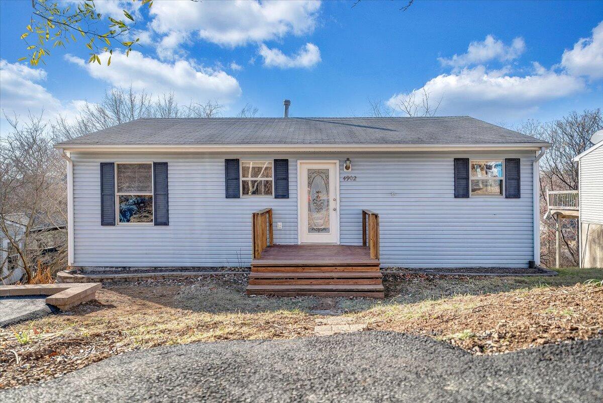 4902 Old Mountain Road Northeast Roanoke, VA 24019 - Photo 2 of 42 a front view of a house with a yard