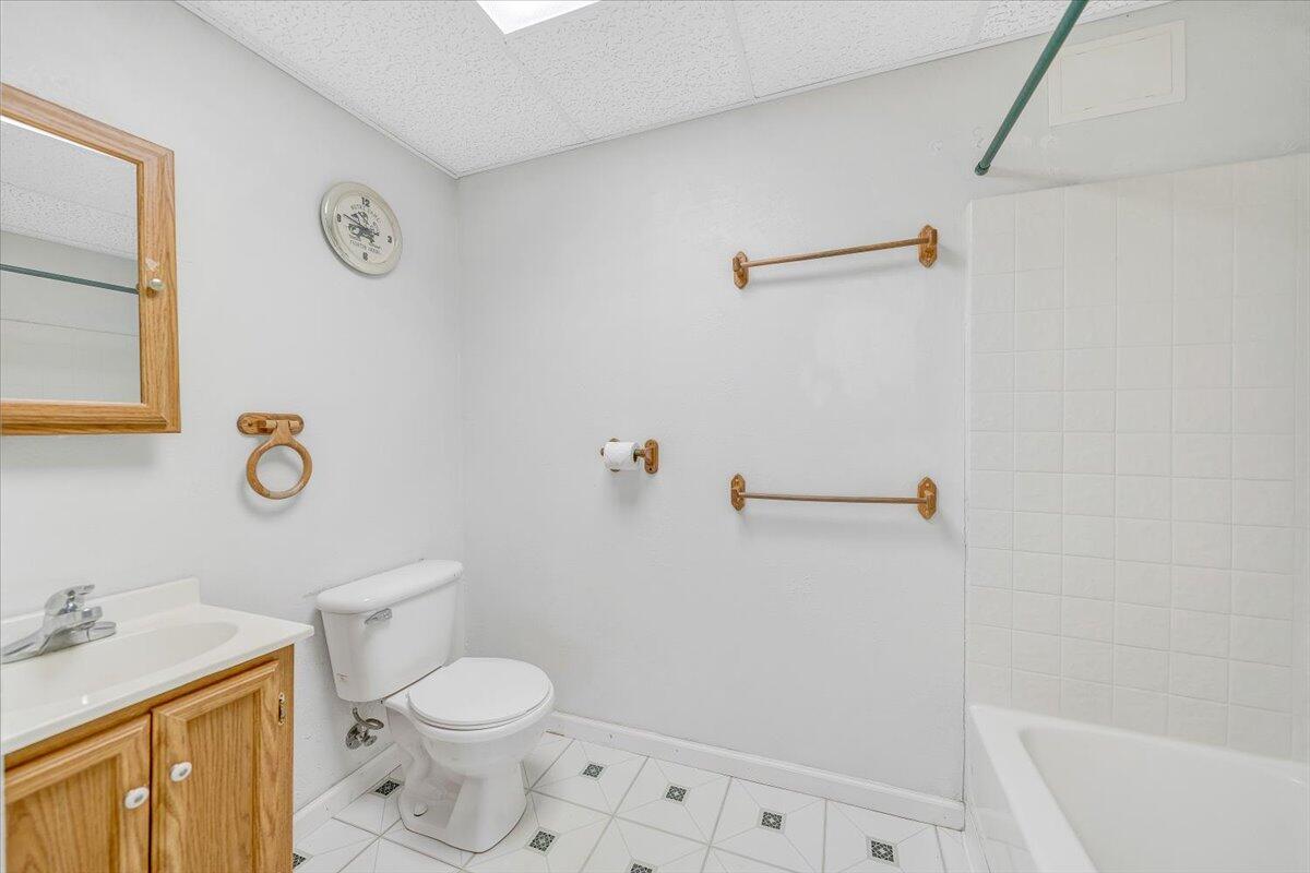 4902 Old Mountain Road Northeast Roanoke, VA 24019 - Photo 29 of 42 a white toilet sitting next to a bathroom sink