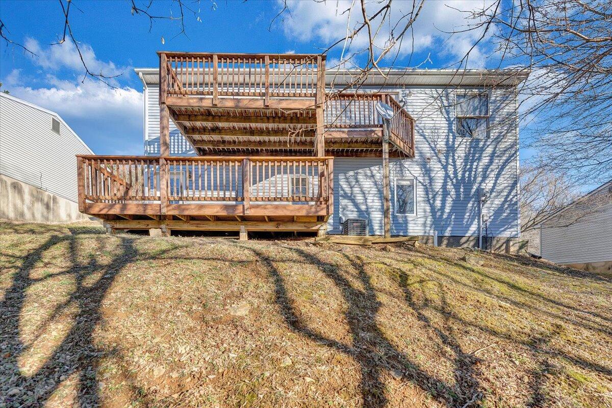 4902 Old Mountain Road Northeast Roanoke, VA 24019 - Photo 38 of 42 a view of a backyard with a small cabin