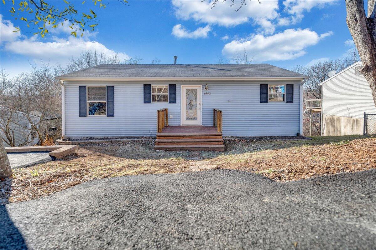 4902 Old Mountain Road Northeast Roanoke, VA 24019 - Photo 42 of 42 a front view of a house with a yard