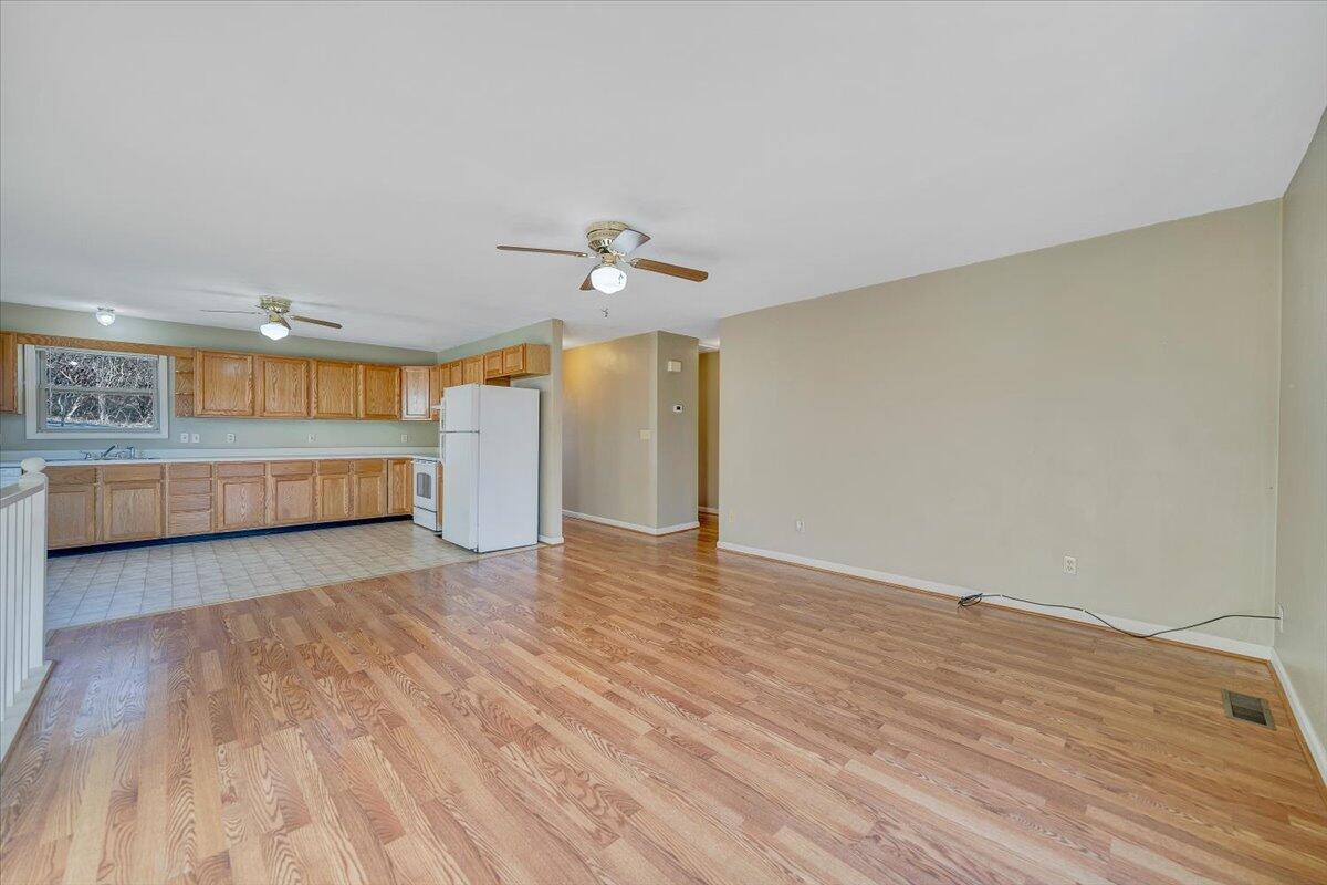 4902 Old Mountain Road Northeast Roanoke, VA 24019 - Photo 6 of 42 wooden floor in an empty room with a window
