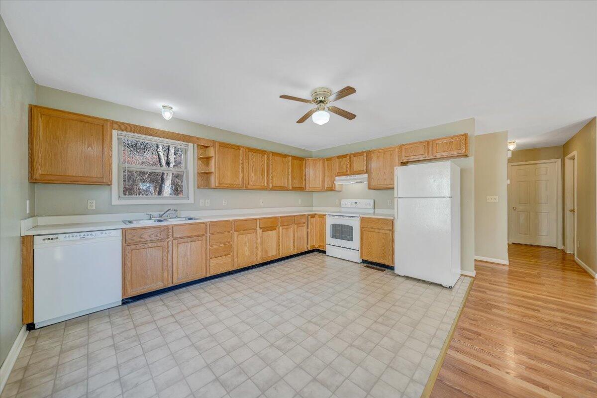 4902 Old Mountain Road Northeast Roanoke, VA 24019 - Photo 7 of 42 a kitchen with stainless steel appliances a refrigerator and a sink