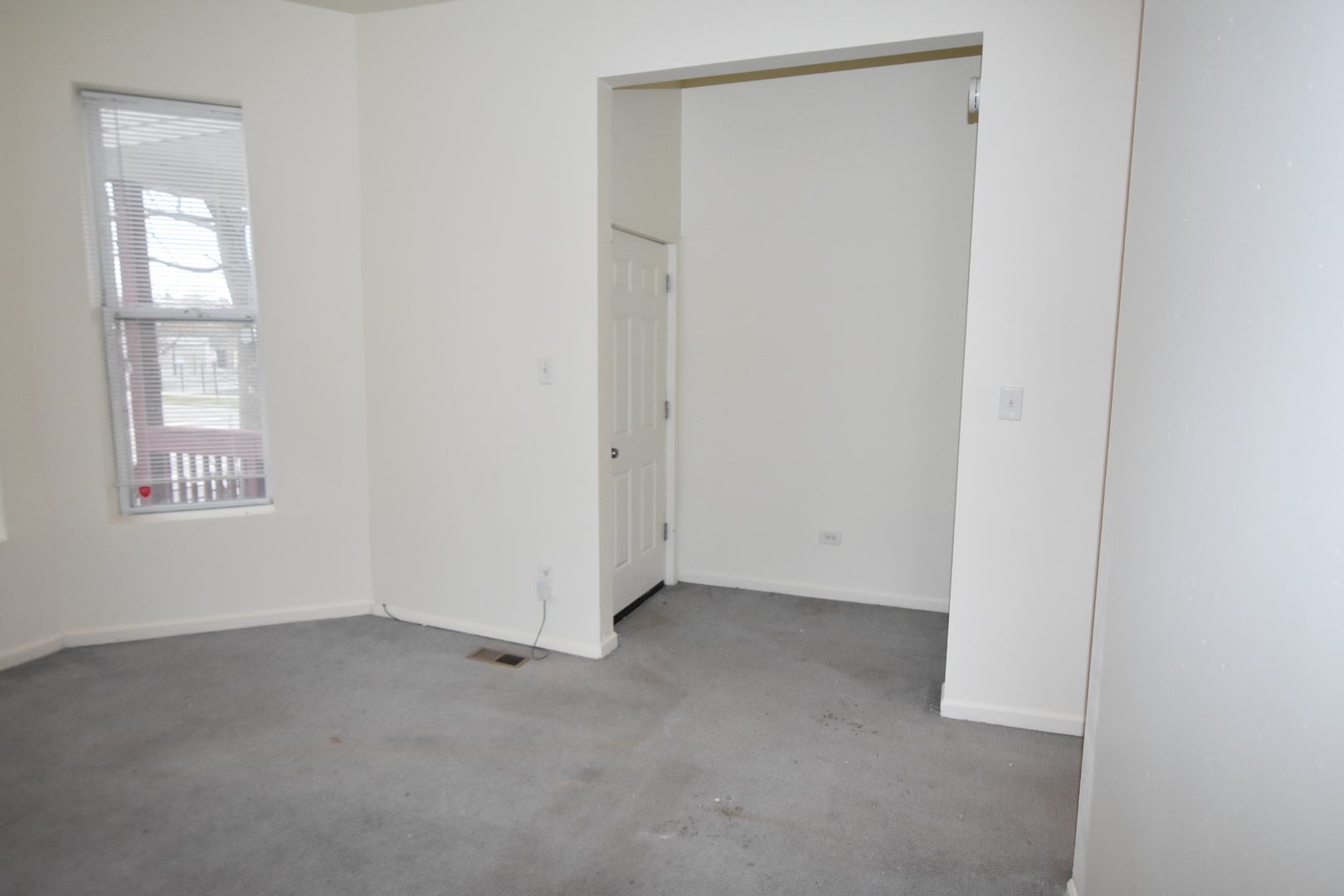 4056 West Jackson Boulevard, Unit 2 Chicago, IL 60624 - Photo 6 of 14 a view of an empty room with windows and closet