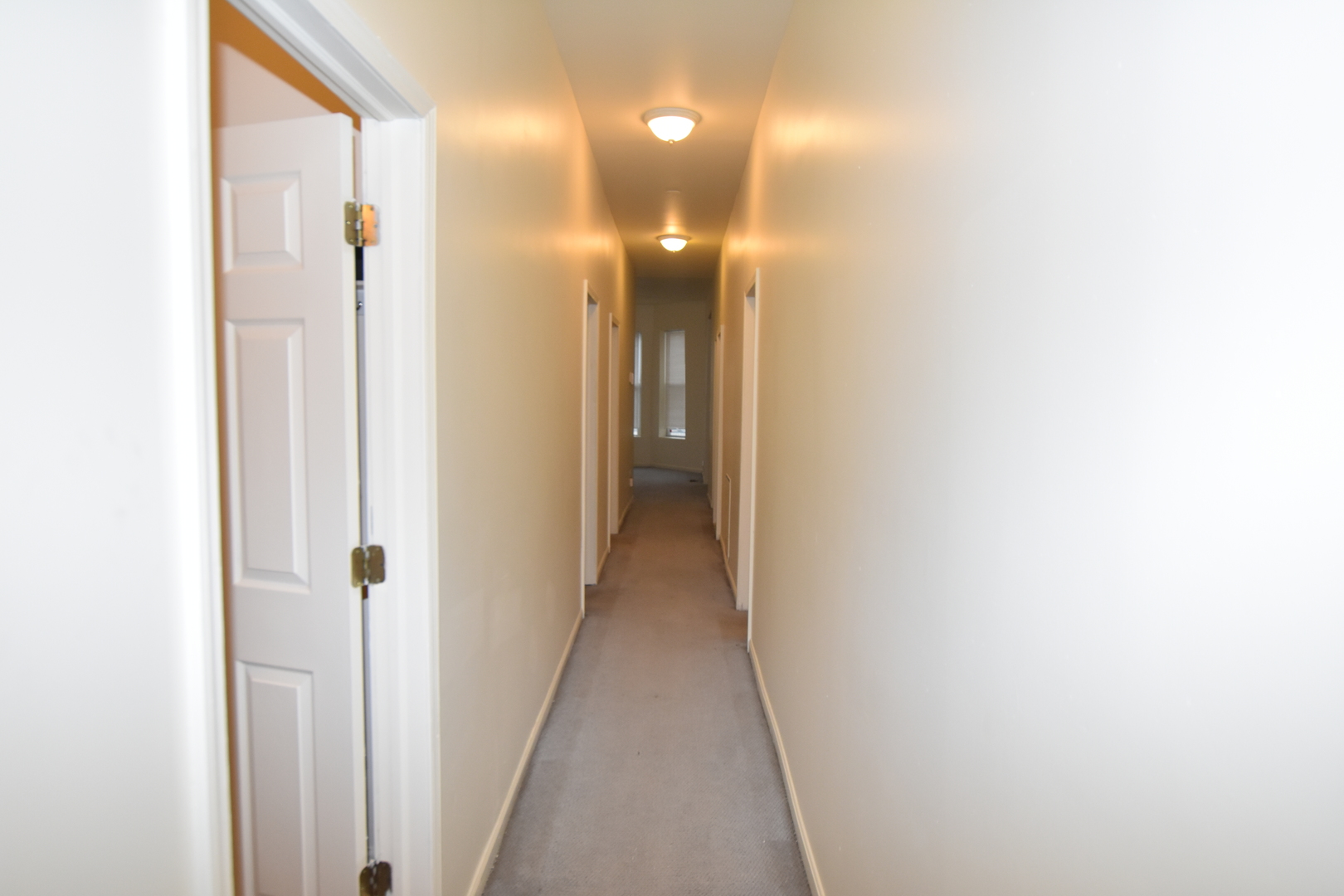 4056 West Jackson Boulevard, Unit 2 Chicago, IL 60624 - Photo 10 of 14 a view of a hallway with wooden floor