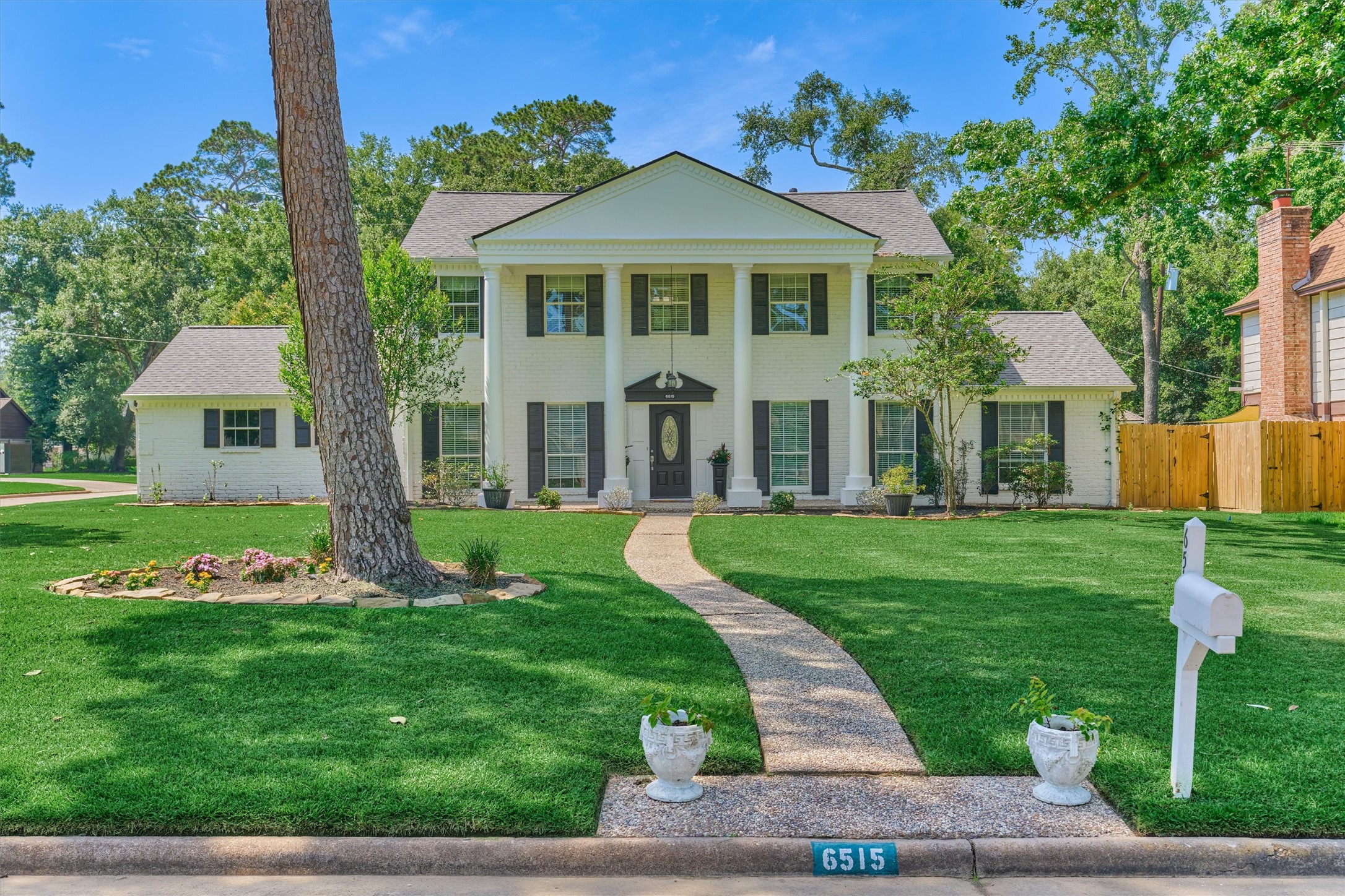 6515 Glenhill Drive Spring, TX 77389 - Photo 1 of 39 a front view of a house with a yard