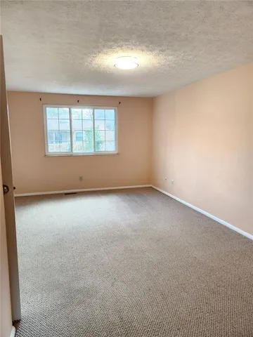an empty room with a windows