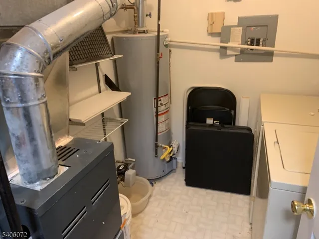 a close view of a utility room with washer and dryer
