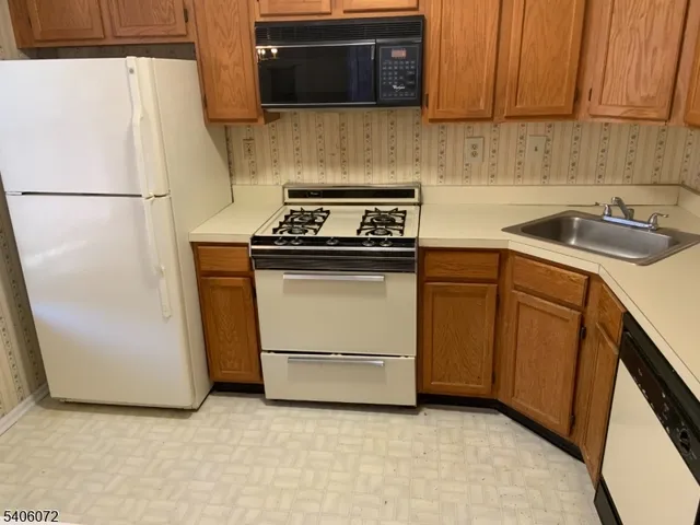 a kitchen with a stove and a microwave
