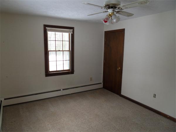 63 Purgatory Road Sutton, MA 01590 - Photo 17 of 22 an empty room with a window