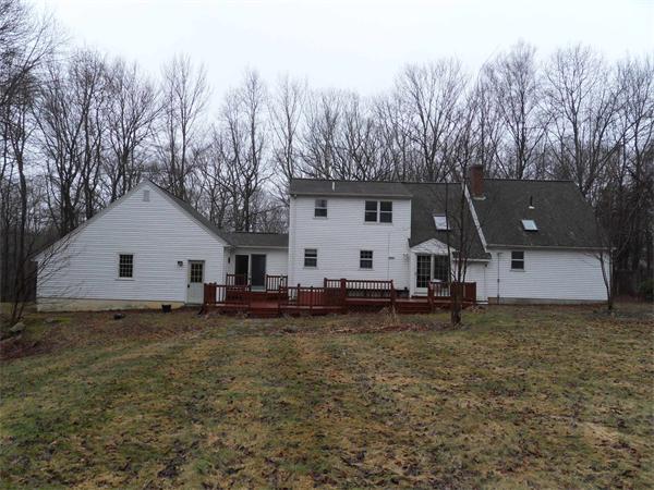 63 Purgatory Road Sutton, MA 01590 - Photo 19 of 22 a view of a house with backyard and trees