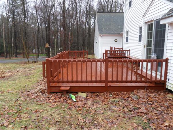63 Purgatory Road Sutton, MA 01590 - Photo 20 of 22 a wooden bench sitting in front of a house