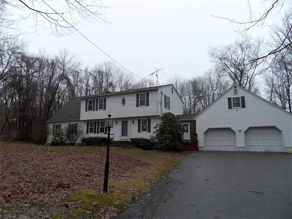 63 Purgatory Road Sutton, MA 01590 - Photo 2 of 22 a front view of a house with a yard and garage